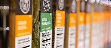 Close-up of olive oil bottles with clear labels and branding.