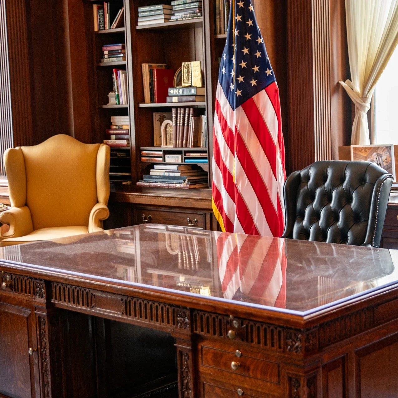 Office with desk and American flag.